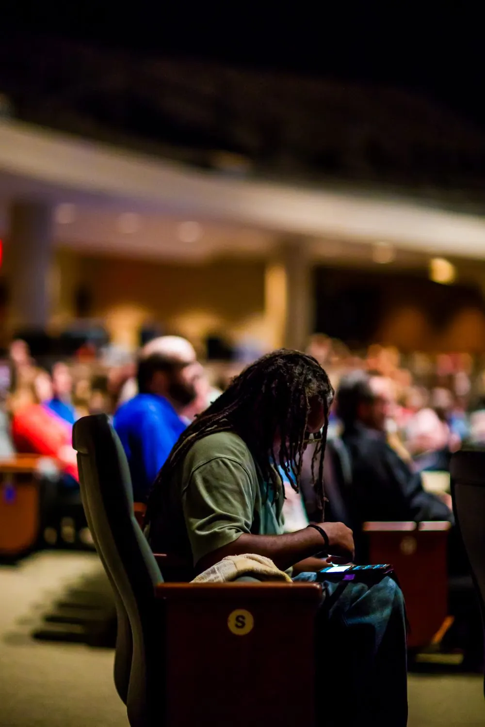 An audience of young people attending a conference session