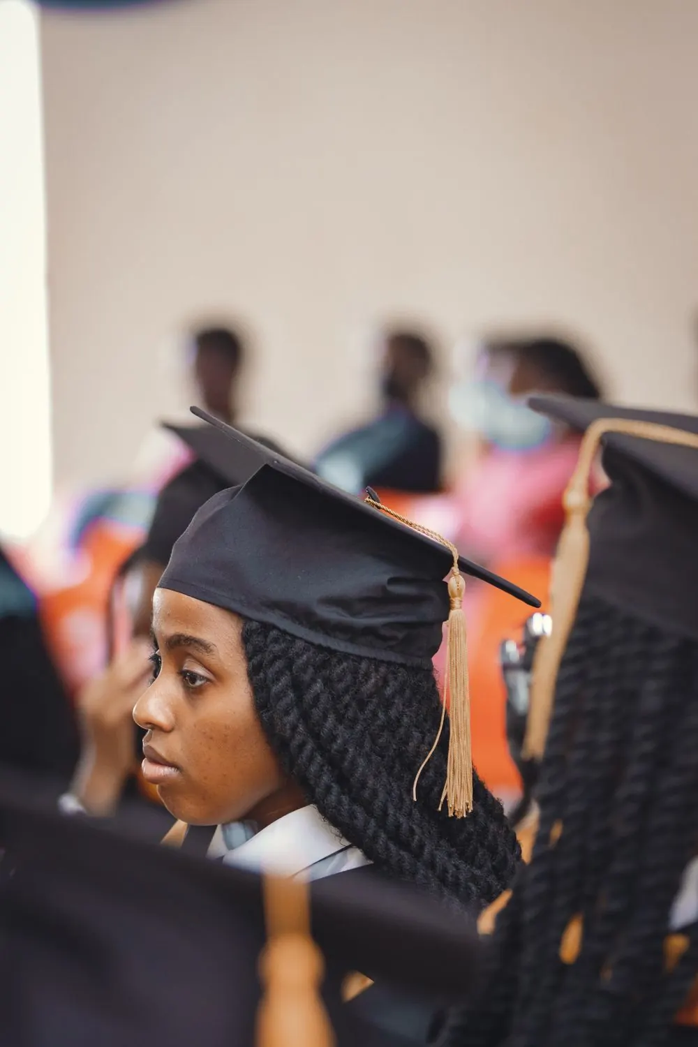 University graduates in caps and gowns at a graduation ceremony